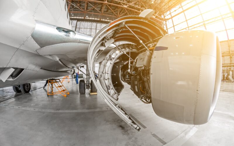 An aircraft undergoing maintenance in a hangar